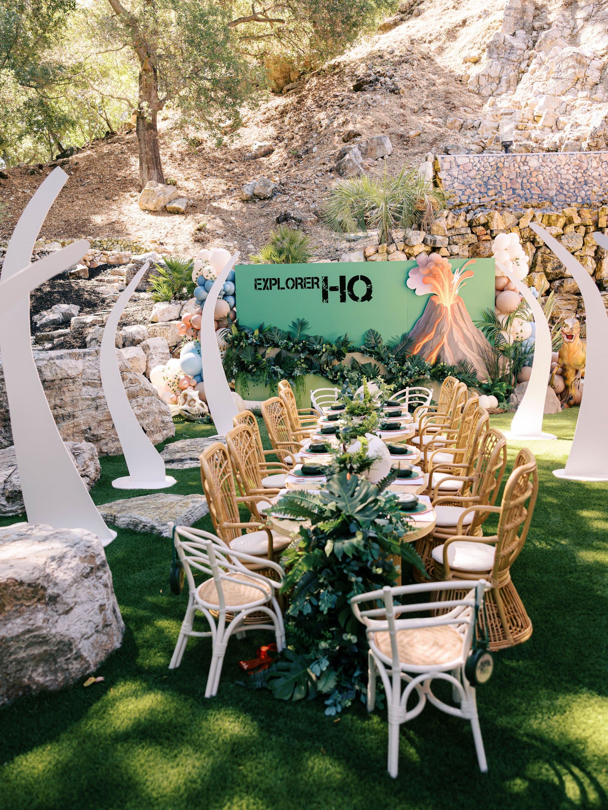 Kids rattan chairs and tables set under the trees
